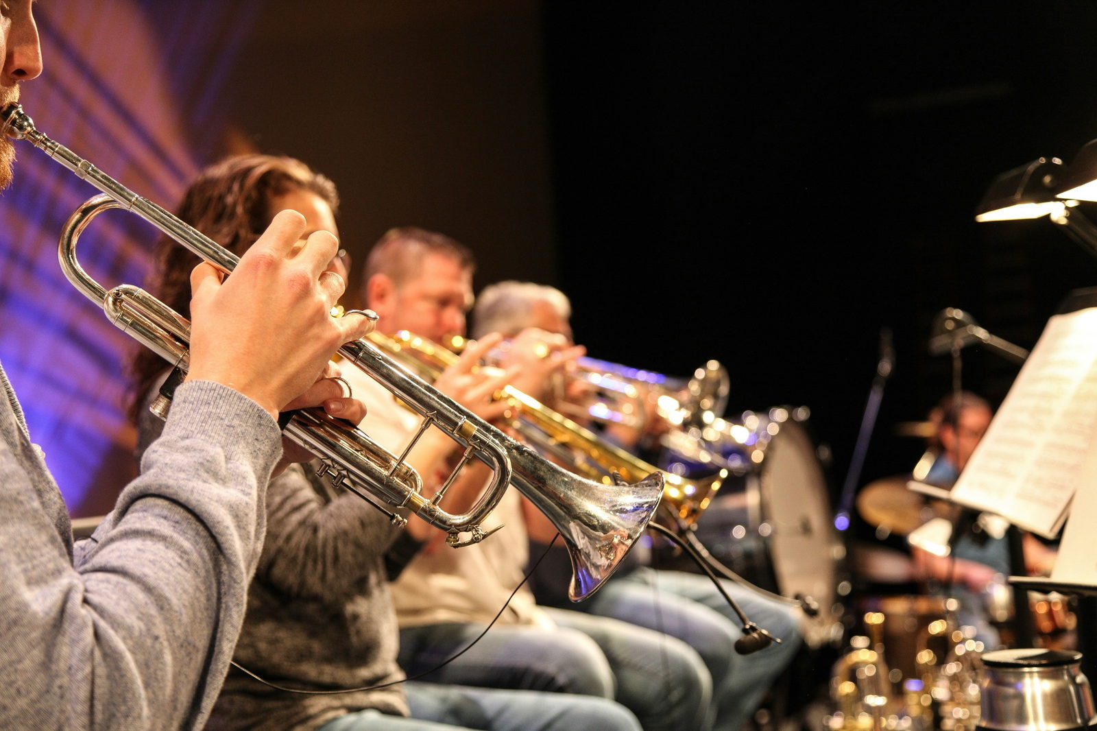 The trumpet section of a big band performing