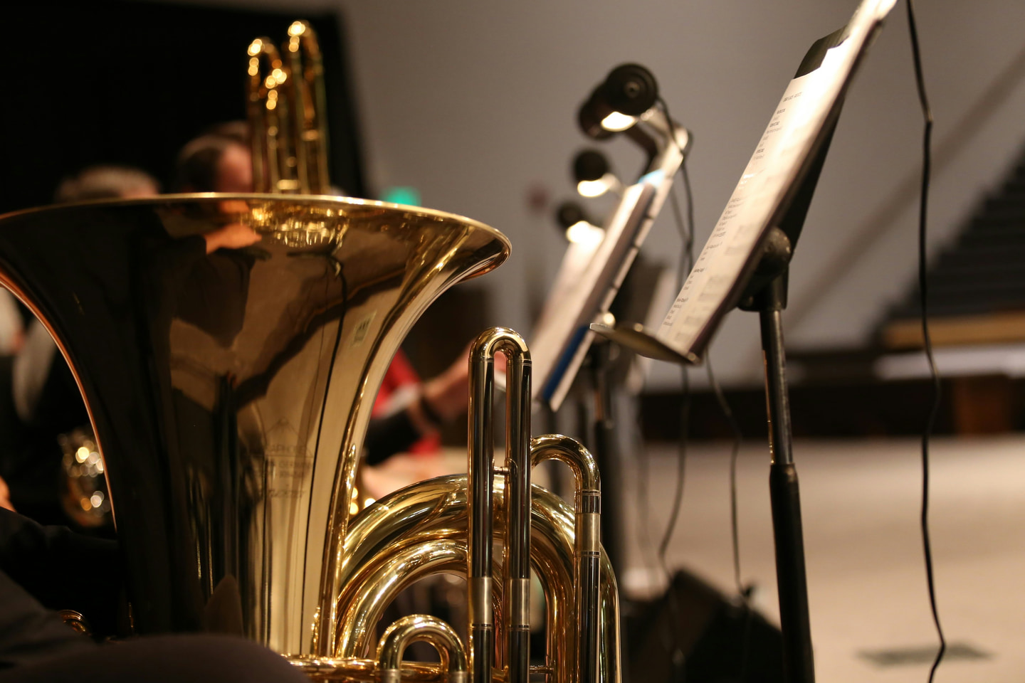 Brass instruments and music stands during an ensemble rehearsal