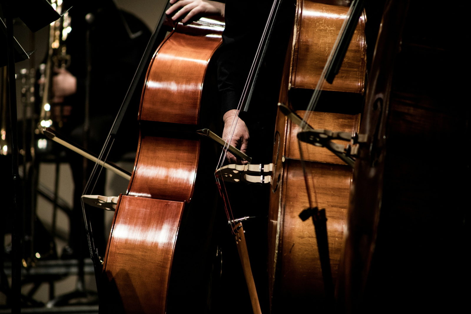 Cellos in the shadow of a stage